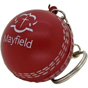 A red cricket ball stress reliever with a silver keyring attachment and a logo.