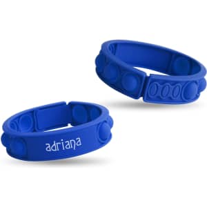 Two blue silicone wristbands featuring raised bubbles and a logo on one band.