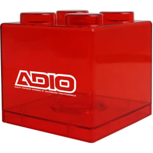 A red square block coin bank with a logo, featuring a distinct block shape.