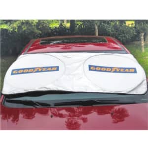 A white foldable car shade with two circular sections laid across the front windshield of a red car, featuring a logo.
