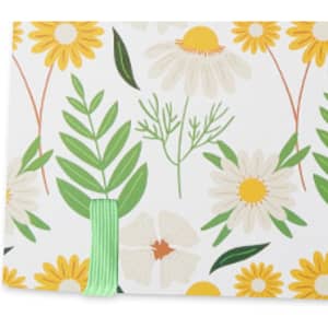 A5 notebook with a full-colour floral design featuring yellow daisies, green leaves, and a green elastic band.