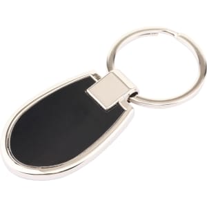 A silver keyring with a black oval-shaped pendant, featuring a sleek design and a branding logo.