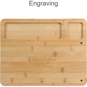 A bamboo cheese board with two compartments, featuring an engraving and a smooth wooden surface.