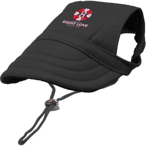 A black dog baseball hat featuring a logo, designed with a strap for secure fitting.