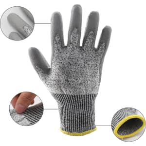 A pair of cut-resistant gloves in grey with a yellow cuff, showcasing textured fingertips and a snug fit.