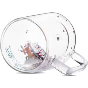 A clear glass Christmas-themed double wall mug with decorative confetti inside. It features a handle and a logo.