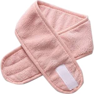 A pink promotional headband with a soft, textured surface and a velcro fastening. It has a branded logo.