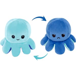 A plush toy featuring a reversible octopus design in light blue and dark blue, displaying different facial expressions.