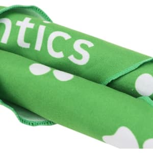 A green triangle pet bandana featuring white spots and a logo.