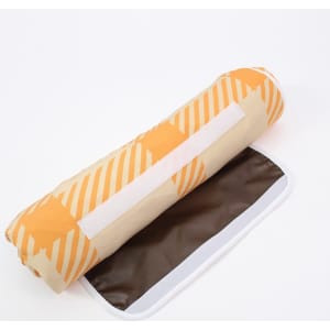 A rolled picnic blanket featuring an orange and beige striped pattern with a brown underside. It includes a logo.