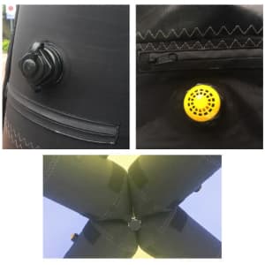 Close-up of a black inflatable marquee's inflation valve, with a yellow air release valve shown.