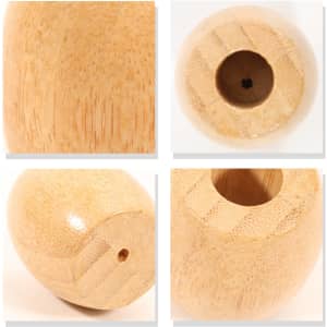 A bamboo toothbrush stand featuring a smooth, natural finish and rounded design. It has a small hole for toothbrush placement.