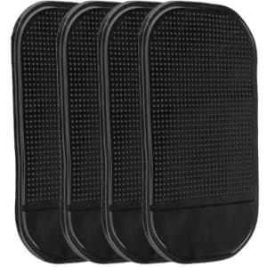 A set of four black dashboard mats with a textured surface. Each mat features a smooth border.