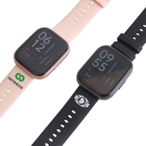 A square smart watch in pink and black with a digital display and a logo on the pink band.