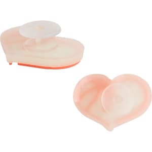 Two peach-coloured heart-shaped shoe charms with a translucent centre and an orange backing, featuring a logo.