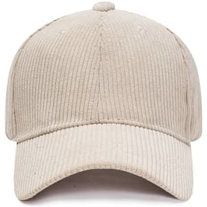 A corduroy baseball cap in a light beige colour with a curved brim and a textured design. It has a logo.