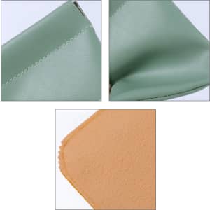 A small pocket cosmetic bag in soft green material with a beige interior and a zipper closure.