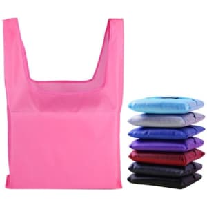 A pink reusable foldaway shopping bag sits alongside folded bags in various colours, including blue, purple, and black.