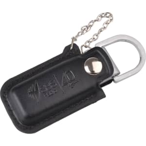 A black leather pouch flash drive with a silver keychain attachment and a logo on the surface.