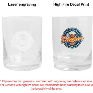 Two clear whiskey glasses are displayed side by side, one with a laser engraving and the other with a colourful decal print.