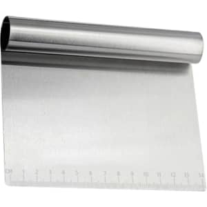 A stainless steel flour cutter with a curved handle and measurement markings along one edge.