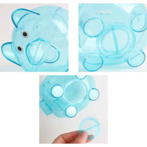 A light blue piggy coin bank with a transparent body, featuring removable coin slots and a cute face.