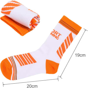 Crew woven sport socks in white and orange, featuring a striped design. One sock is laid flat, and another is rolled.
