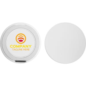 A circular wireless charging stand in silver, featuring a logo on one side and a smooth white surface on the other.