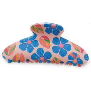 A hair clip in pink with blue flowers and leaves, featuring a curved design and detailed grip edges.
