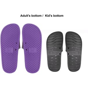 A pair of PVC slides featuring a purple adult size sole and a black kid size sole, each with textured bottoms.