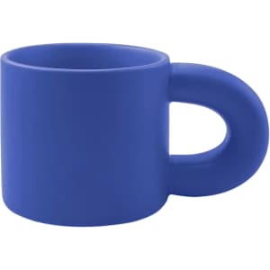 A blue ceramic coffee mug with a unique handle design, featuring a smooth matte finish and a logo.