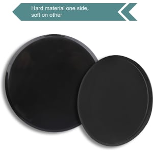 A pair of black yoga sliding disks, featuring a hard material on one side and a soft surface on the other.