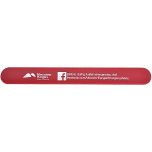 A red silicone slap band featuring a logo and additional details on one side.
