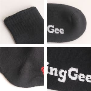 Crew woven bamboo work socks in black, featuring a logo. The fabric has a textured finish and reinforced areas.