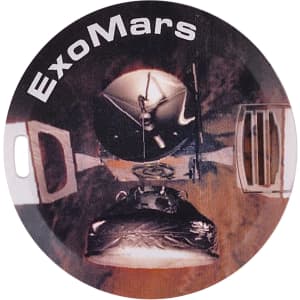 A round flash drive featuring a design related to ExoMars, predominantly in shades of black and metallic grey.