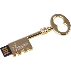 A gold retro key-shaped flash drive with a USB connector and a logo on its surface.