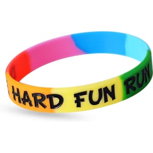 A multicoloured silicon wristband featuring a logo, with vibrant sections of pink, blue, yellow, and green.