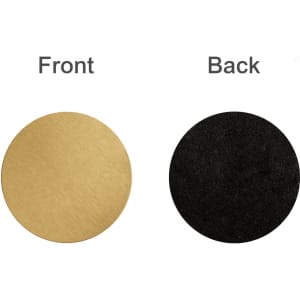 A round metal coaster featuring a gold front and a black back, with a logo present.