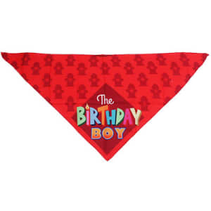 A red triangle pet bandana featuring a playful birthday theme and a logo.