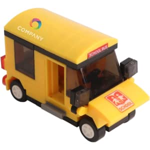 A yellow school bus building block set with black wheels and a prominent logo on top.