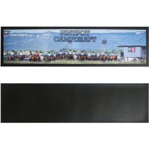 A long counter mat featuring a vibrant outdoor scene with horses and riders, predominantly in green and brown tones.