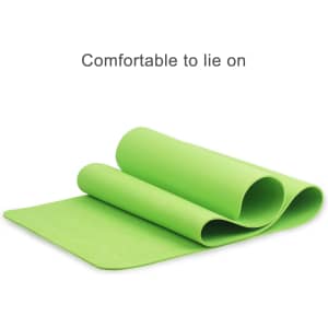 A green premium TPE yoga mat, rolled partially open, with a smooth surface and a logo on it.