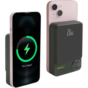A magnetic wireless power bank in black, next to a smartphone displaying a charging indicator. Features a digital power level display.