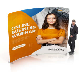 A curved tension fabric display wall featuring a model in an orange top, with a logo and promotional text on a bright backdrop.