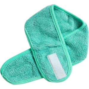 A green promotional headband made of soft, fluffy material with a velcro fastening.
