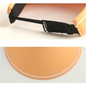 A wide brim sun visor hat in a soft orange colour, featuring a black adjustable strap and a simple white trim.