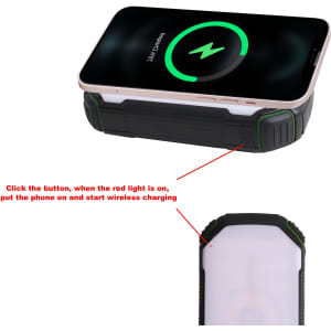 A black and green 20000mAh outdoor solar wireless power bank with a charging phone on top. It features a logo.