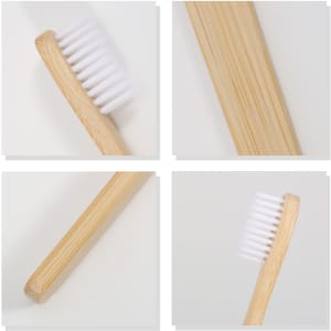 A large flat handle toothbrush with a bamboo handle and white bristles, displayed from multiple angles.