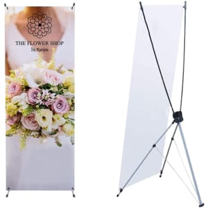 A medium X-frame banner featuring a floral design with pink and white flowers, supported by a black frame.
