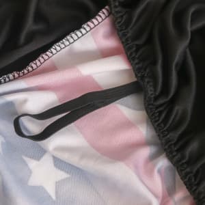 A full colour car seat cover featuring a black outer layer and a design with a red, white, and blue pattern inside.